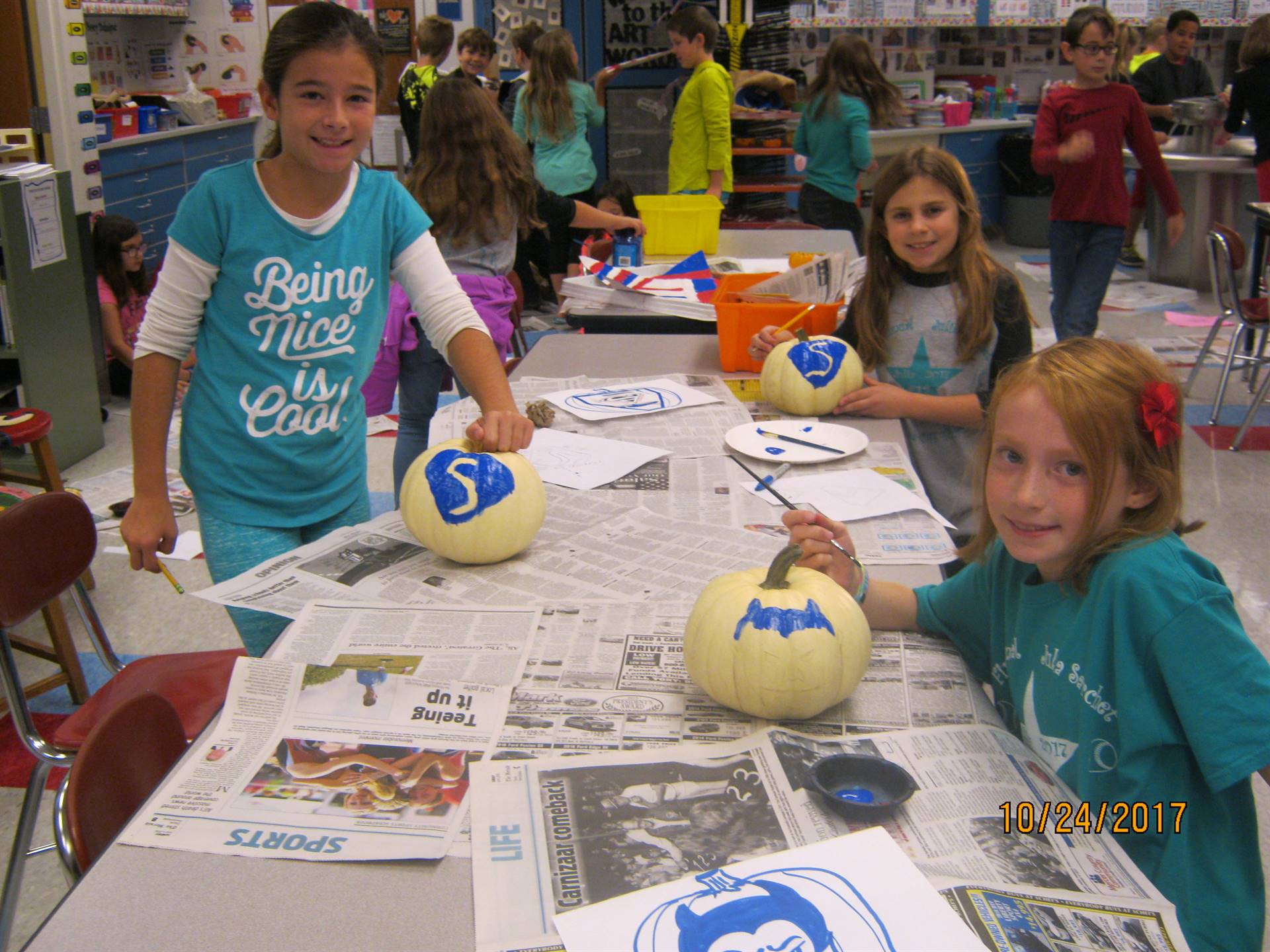 Community artists' "FALL-OW the Blue Devil Way"