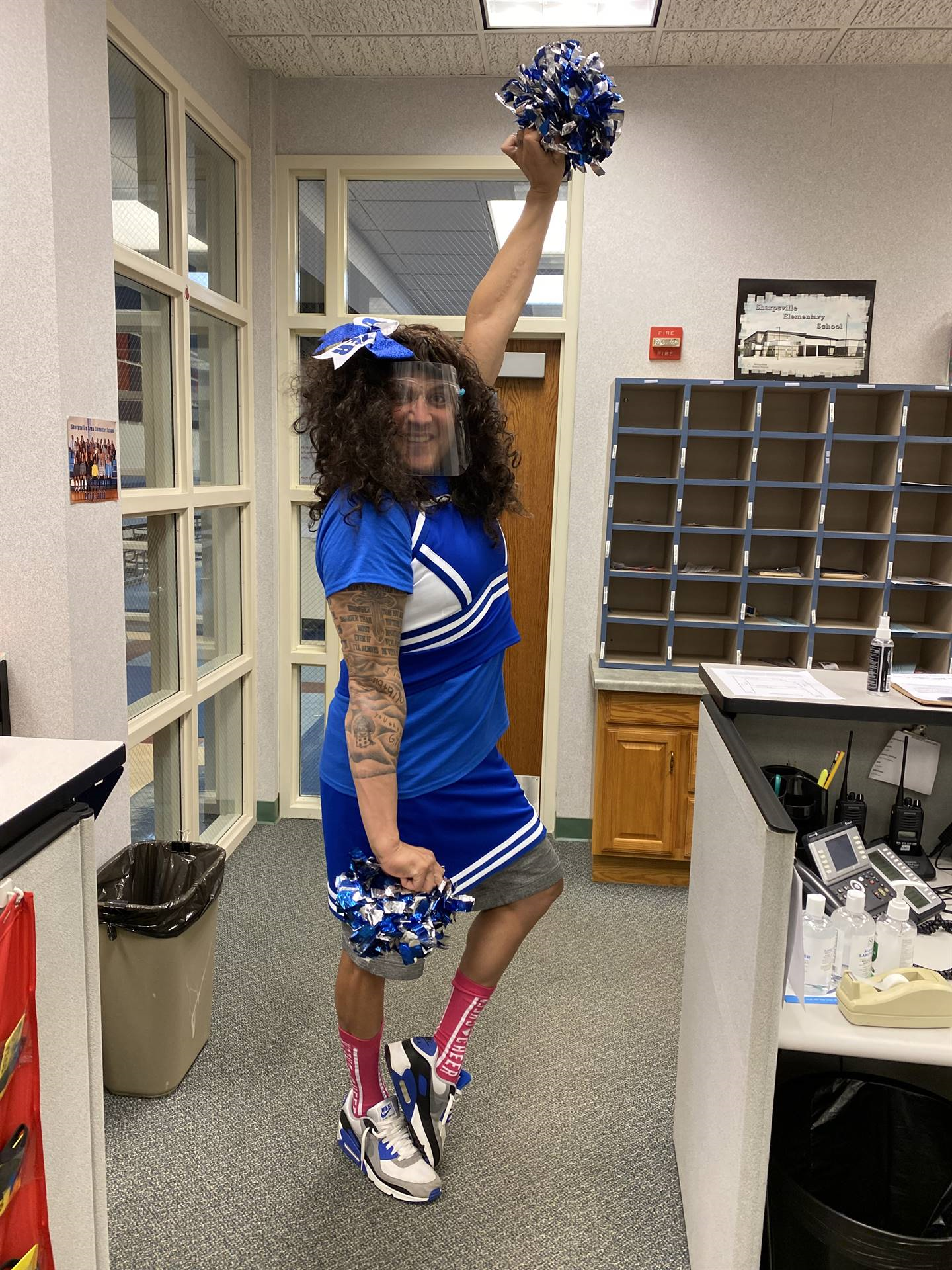 School staff member in Blue Devils cheerleading uniform